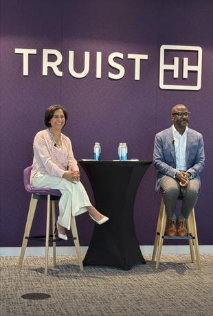 Allyn Shaw in a fireside conversation beneath the Truist logo